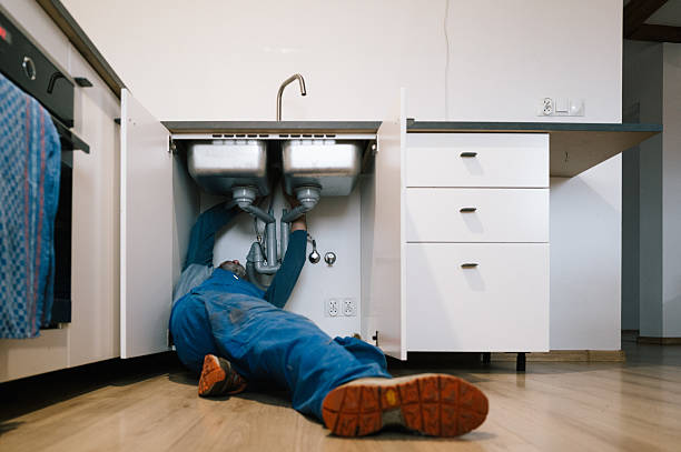 Professional Emergency Plumber technician working in Sandoval, IL
